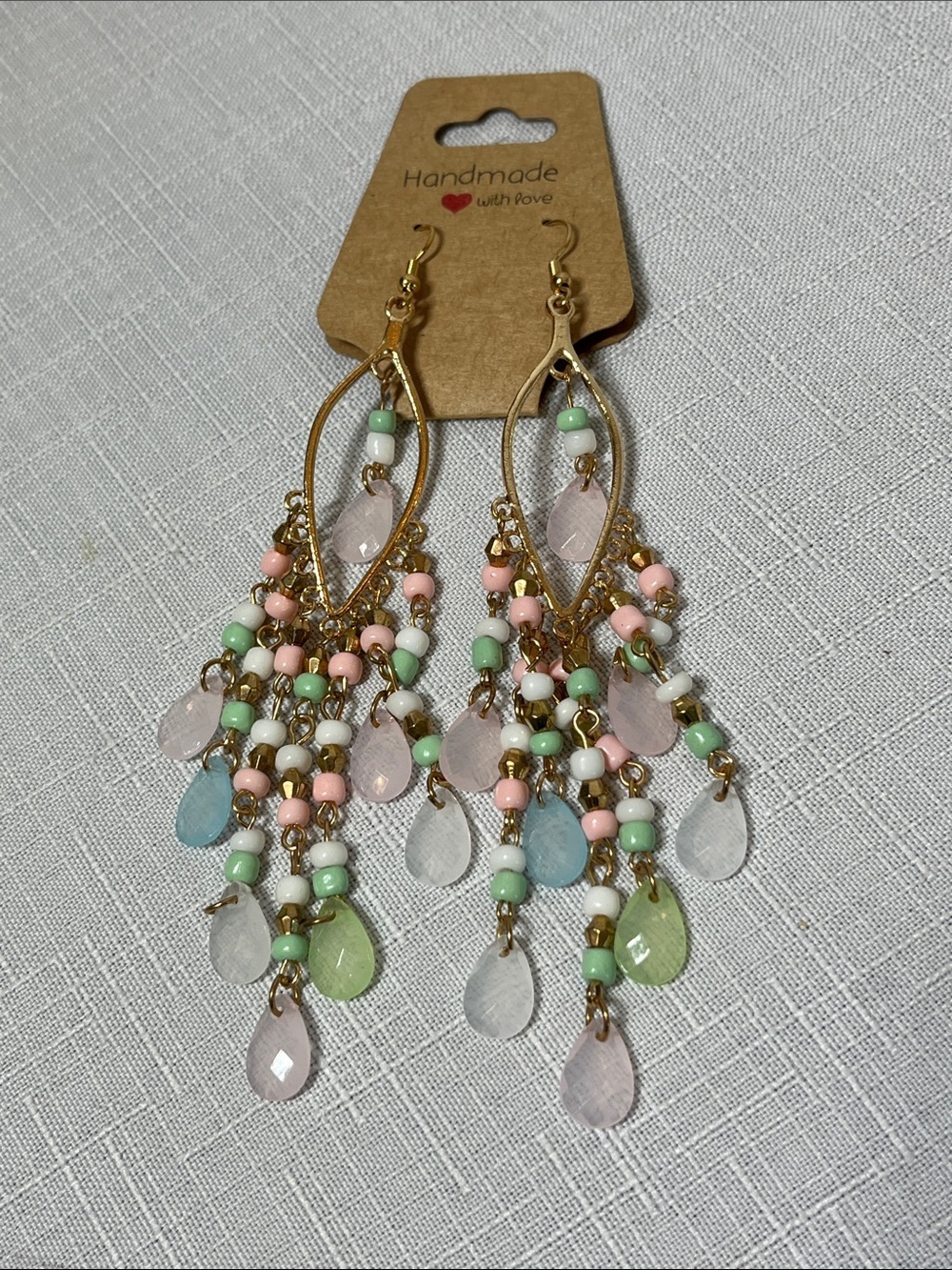 NEW Handmade Pastel Bead Chandelier Earrings - Blue Pink & Mint
Gold tone
Gangle